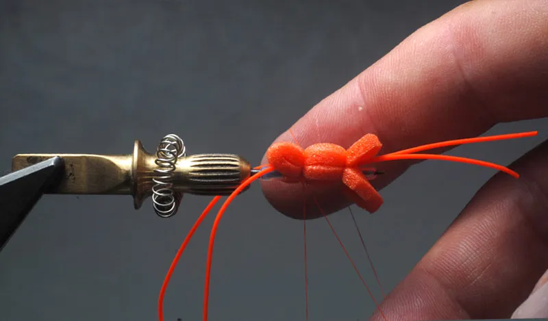 Whip finish - A <a href="/tiebetter/whip/">hand whip finish</a> is the easiest way to reach over the fly and finish it in the rear groove.